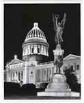Arkansas State Capitol with statue view, night exterior showing Christmas lights